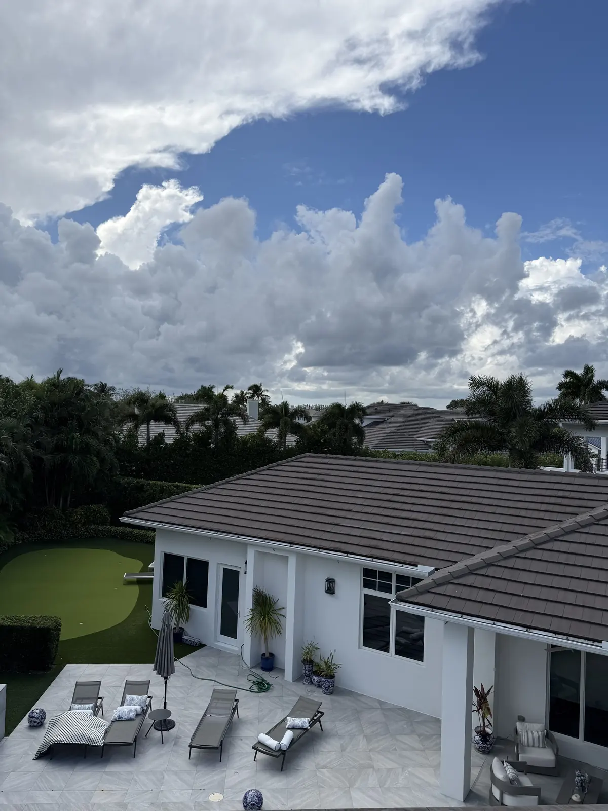Tile roof after soft washing on a waterfront residence